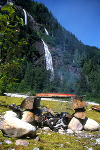 Enjoy sockeye salmon cooked over an open fire by the wild Exchamsiks River